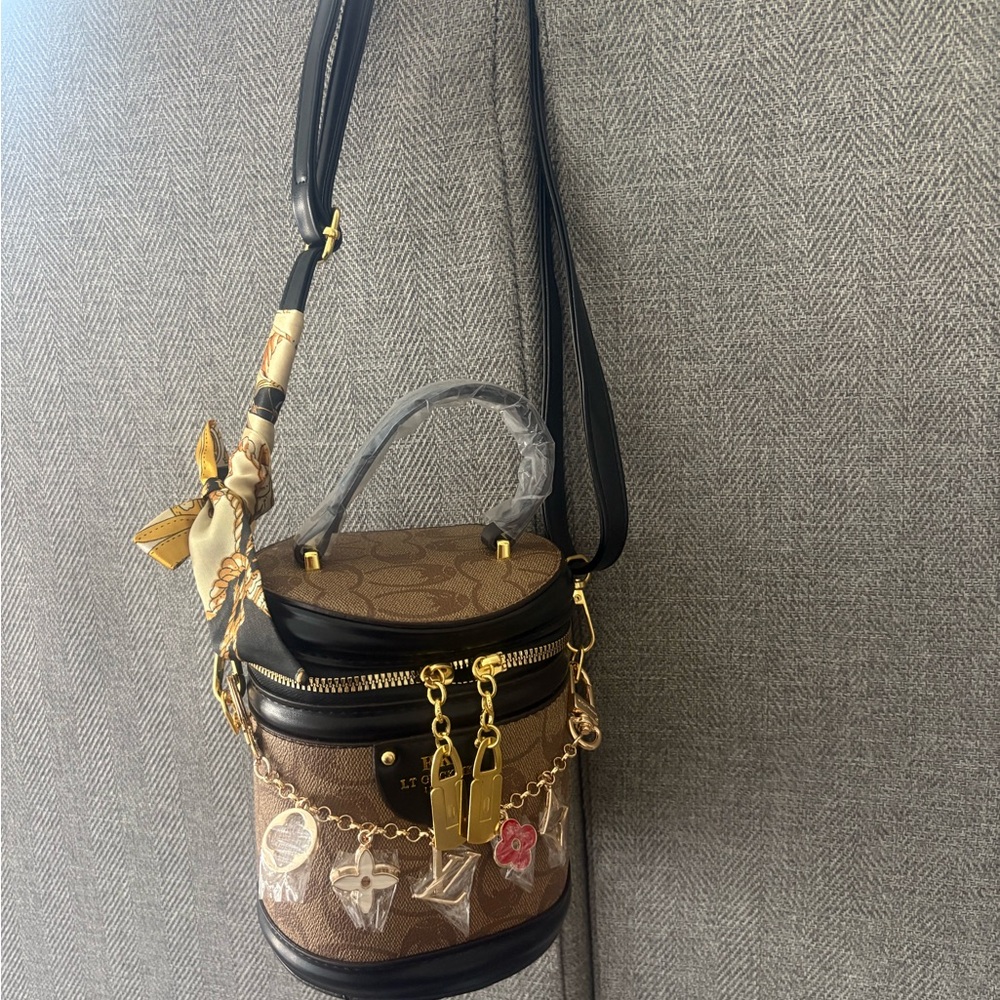 Brown Monogram Cylinder Crossbody Bag with Gold Accents